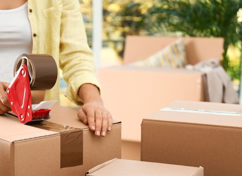 woman packing boxes for moving