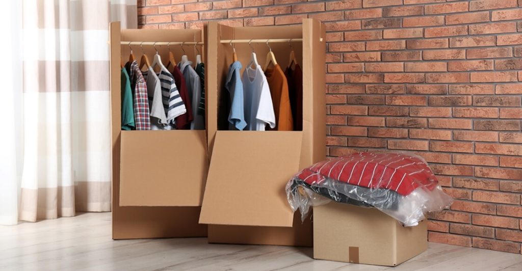 Clothes stored inside wardrobe boxes.