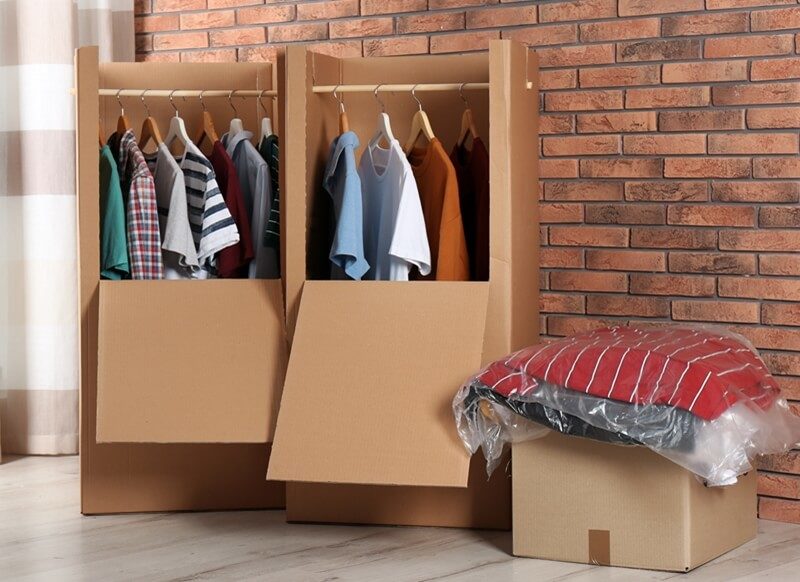 Clothes stored inside wardrobe boxes.